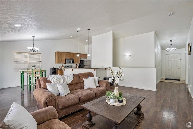 living area with baseboards, dark wood-style floors, an inviting chandelier, and lofted ceiling