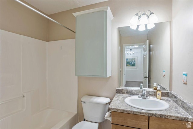 full bathroom with toilet, bathing tub / shower combination, an inviting chandelier, and vanity