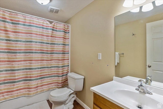 full bathroom featuring visible vents, shower / tub combo, toilet, vanity, and wood finished floors