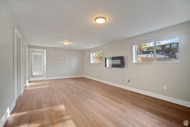 151 S Bernice Way N, Salt Lake, UT 84054 - unfurnished living room with light wood finished floors and baseboards