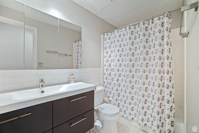 151 S Bernice Way, North Salt Lake, UT 84054 - bathroom featuring toilet, vanity, backsplash, tile walls, and tile patterned floors