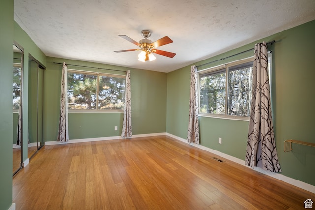 151 S Bernice Way, North Salt Lake, UT 84054 - unfurnished room with ceiling fan, a textured ceiling, and light hardwood / wood-style flooring