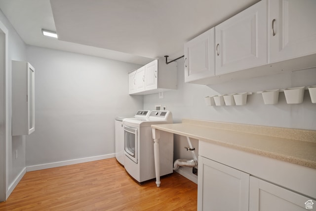 151 S Bernice Way, North Salt Lake, UT 84054 - laundry area featuring cabinets, washer and dryer, and light hardwood / wood-style flooring