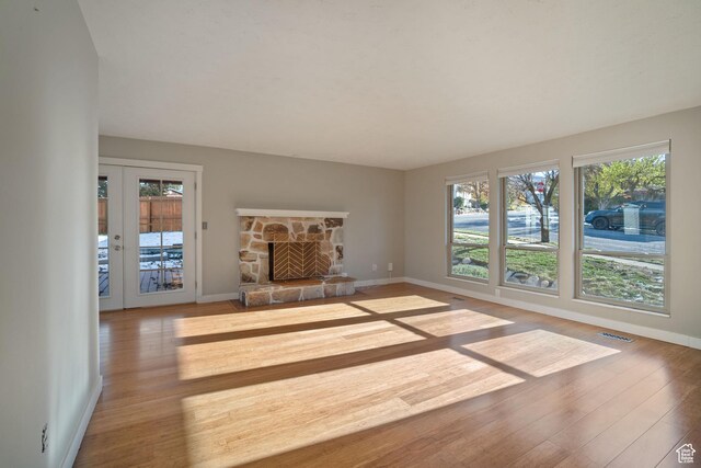 151 S Bernice Way N, Salt Lake, UT 84054 - unfurnished living room featuring baseboards, wood finished floors, and a fireplace