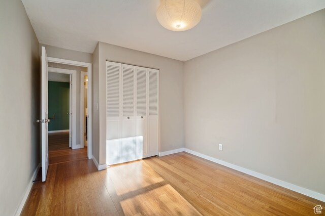 151 S Bernice Way, North Salt Lake, UT 84054 - unfurnished bedroom featuring a closet and hardwood / wood-style flooring