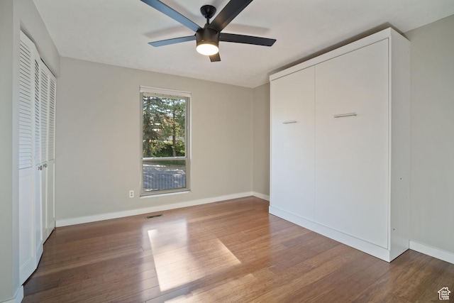 151 S Bernice Way N, Salt Lake, UT 84054 - unfurnished bedroom featuring wood finished floors, baseboards, and ceiling fan