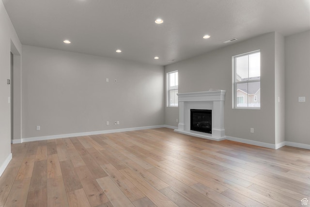 1849 S 2475 W, West Haven, UT 84401 - unfurnished living room featuring light hardwood / wood-style flooring