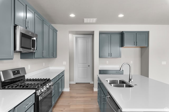 1849 S 2475 W, West Haven, UT 84401 - kitchen featuring light hardwood / wood-style floors, sink, and appliances with stainless steel finishes