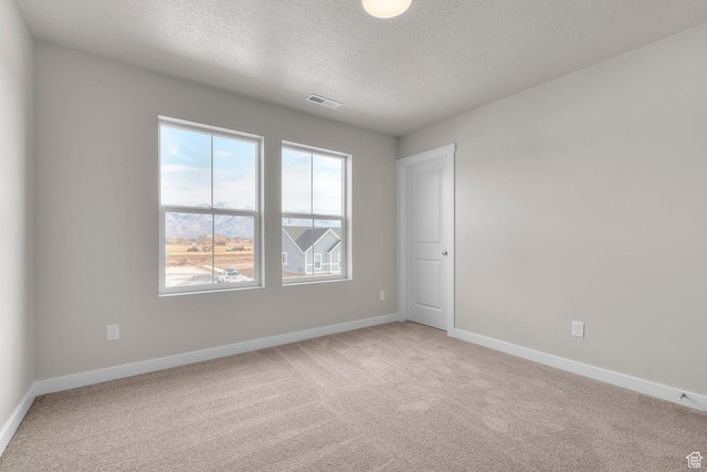 1849 S 2475 W, West Haven, UT 84401 - unfurnished room with carpet flooring and a textured ceiling