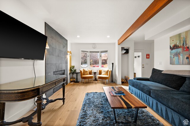 1492 W Meadow Loop Rd Unit 21/22, Snyderville, UT 84098 - living room featuring a fireplace, light hardwood / wood-style floors, and beamed ceiling