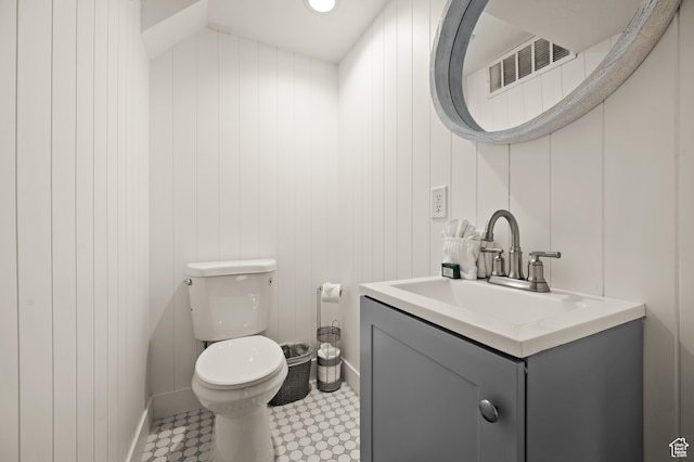 1492 W Meadow Loop Rd Unit 21/22, Snyderville, UT 84098 - bathroom featuring vanity, toilet, and wood walls