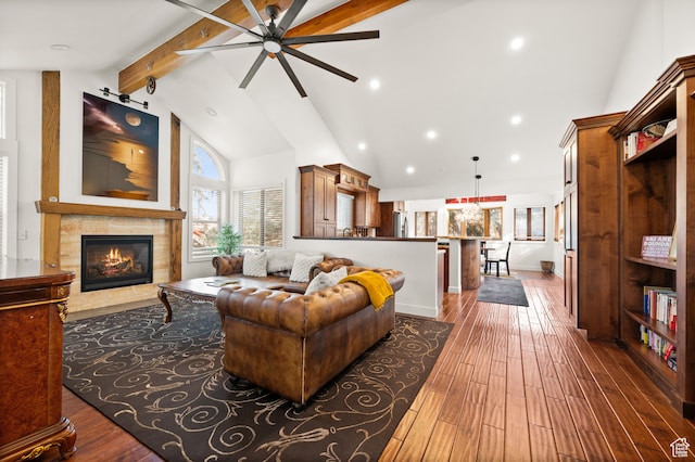 1492 W Meadow Loop Rd Unit 21/22, Snyderville, UT 84098 - living room with beam ceiling, a tile fireplace, ceiling fan, and dark wood-type flooring