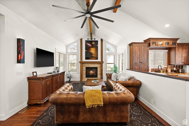 1492 W Meadow Loop Rd Unit 21/22, Snyderville, UT 84098 - living room featuring ceiling fan, dark wood-type flooring, sink, a tile fireplace, and vaulted ceiling with beams