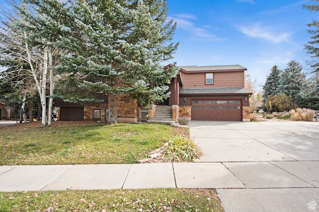 1492 W Meadow Loop Rd Unit 21/22, Snyderville, UT 84098 - view of front facade featuring a garage and a front lawn