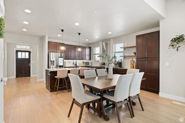 6443 W Early Bird Dr, South Jordan, UT 84009 - dining room with recessed lighting, healthy amount of natural light, light wood-type flooring, and baseboards