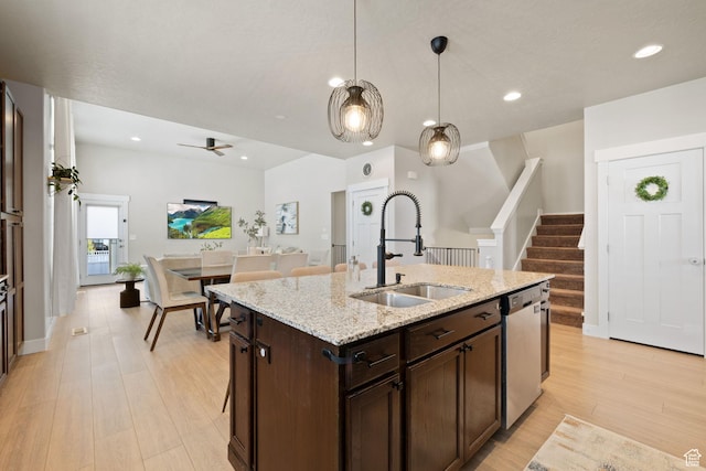 6443 W Early Bird Dr, South Jordan, UT 84009 - kitchen featuring a sink, stainless steel dishwasher, dark brown cabinets, light wood-type flooring, and decorative light fixtures
