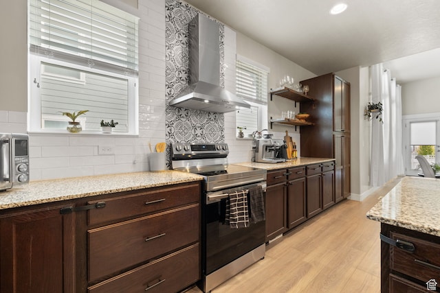 6443 W Early Bird Dr, South Jordan, UT 84009 - kitchen with stainless steel range with electric cooktop, wall chimney range hood, light wood-style flooring, and healthy amount of natural light
