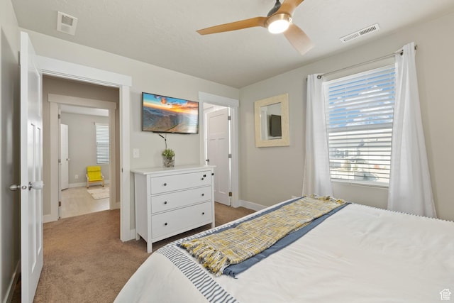 6443 W Early Bird Dr, South Jordan, UT 84009 - bedroom featuring light colored carpet, baseboards, and a ceiling fan