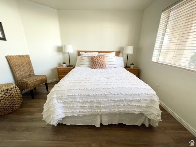 bedroom featuring dark hardwood / wood-style flooring