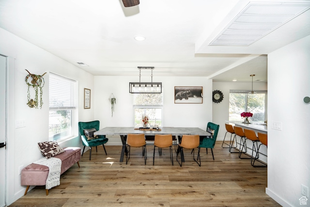dining area featuring light wood-type flooring