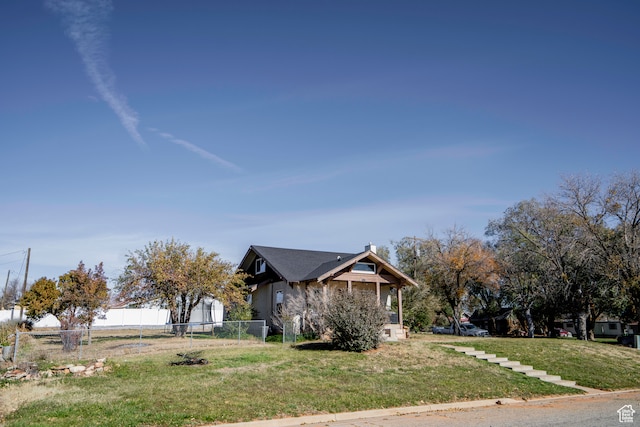view of property exterior with central AC and a yard