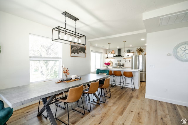 dining area with light hardwood / wood-style flooring