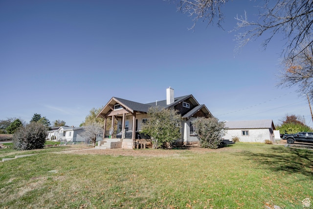 view of front of property with a porch and a front lawn