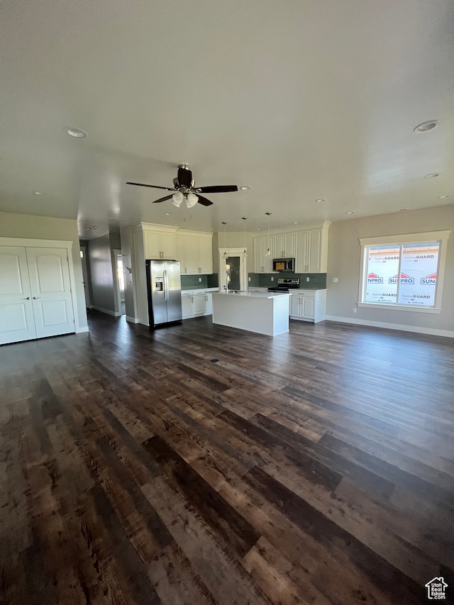437 S 580 W, Providence, UT 84332 - unfurnished living room with ceiling fan and dark hardwood / wood-style flooring