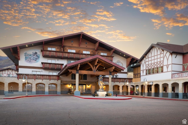 view of outdoor building at dusk