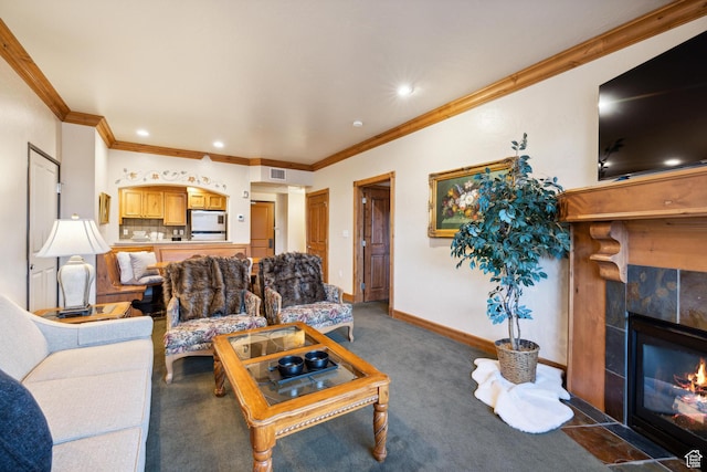 carpeted living room featuring a tiled fireplace and crown molding