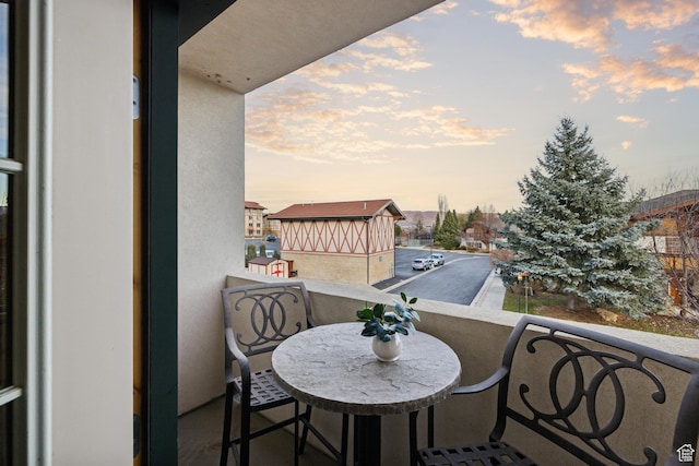 view of balcony at dusk
