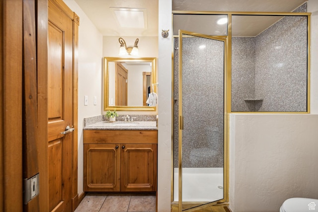 bathroom with tile patterned flooring, vanity, and an enclosed shower