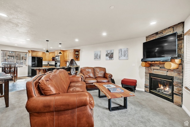 3521 N Fox Run Unit 811, Eden, UT 84310 - living area featuring light colored carpet, recessed lighting, a fireplace, and baseboards