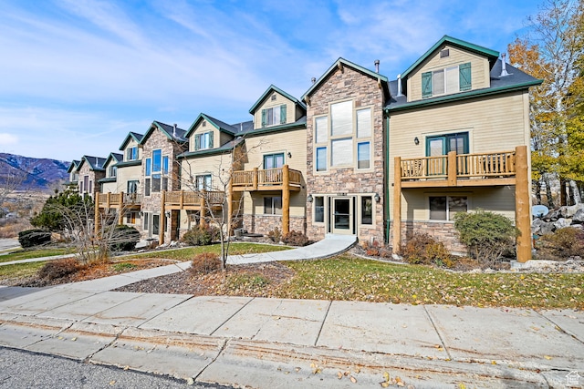 3521 N Fox Run Unit 811, Eden, UT 84310 - view of property featuring stone siding, a residential view, and a balcony
