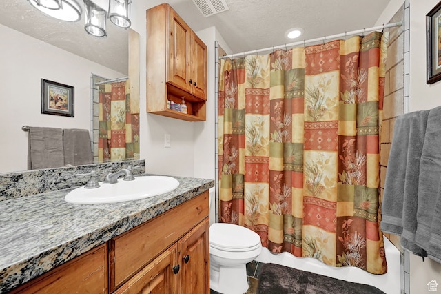 3521 N Fox Run Unit 811, Eden, UT 84310 - bathroom with toilet, a textured ceiling, and vanity