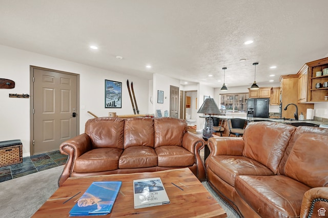 3521 N Fox Run Unit 811, Eden, UT 84310 - living room featuring recessed lighting, stone finish floors, and a textured ceiling