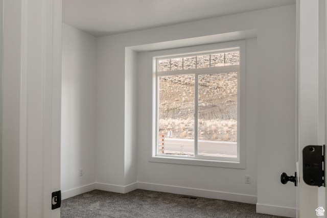 1462 N 4075 W Unit 2, Vernal, UT 84078 - spare room featuring dark carpet and baseboards