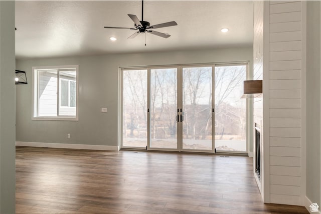 1462 N 4075 W Unit 2, Vernal, UT 84078 - empty room with baseboards, a ceiling fan, wood finished floors, recessed lighting, and a large fireplace