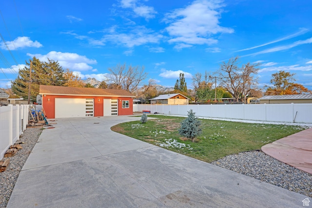 4325 S Park St E, Murray, UT 84107 - view of front facade with an outbuilding, a front yard, and a garage