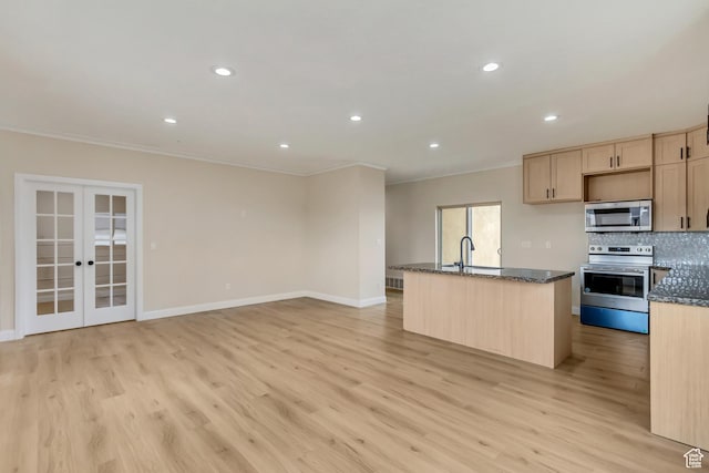 408 Rigdon St, Grantsville, UT 84029 - kitchen featuring stainless steel appliances, crown molding, light brown cabinets, light wood-style floors, and dark stone counters