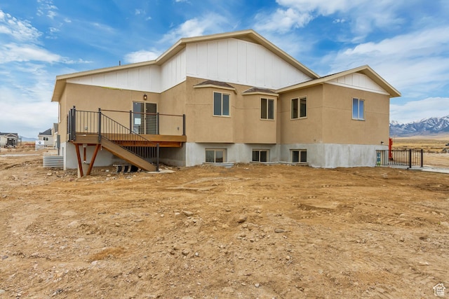 408 Rigdon St, Grantsville, UT 84029 - back of property featuring a deck with mountain view, board and batten siding, and stairs