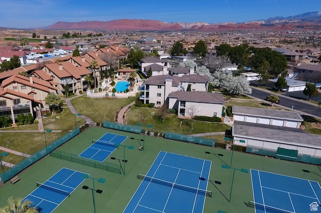 birds eye view of property featuring a mountain view