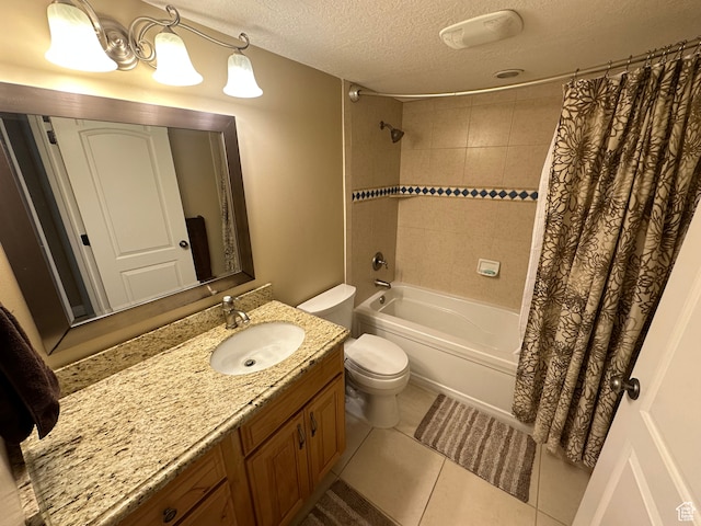 full bath featuring toilet, vanity, shower / bathtub combination with curtain, a textured ceiling, and tile patterned flooring