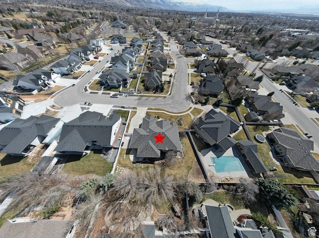 birds eye view of property with a residential view