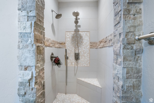 bathroom with tiled shower