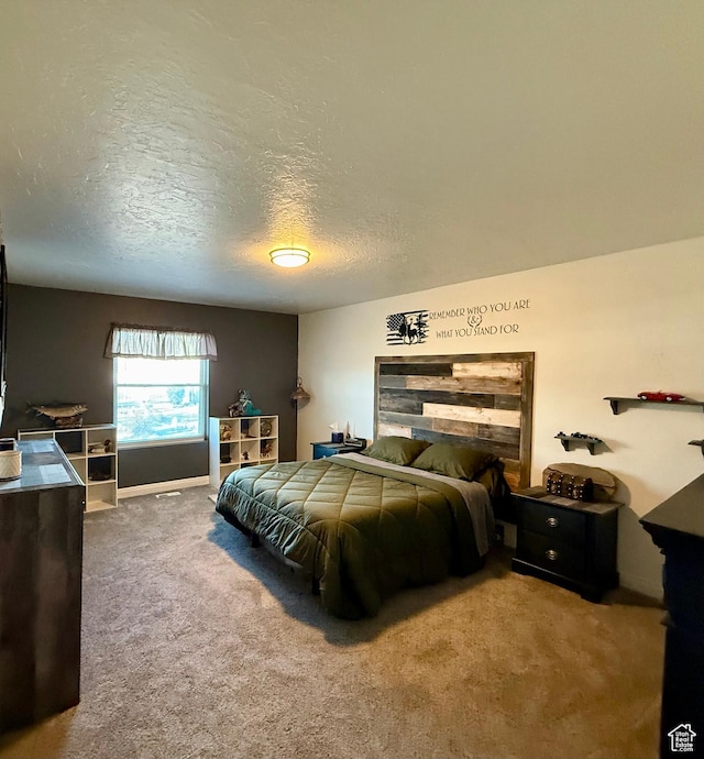 carpeted bedroom with a textured ceiling