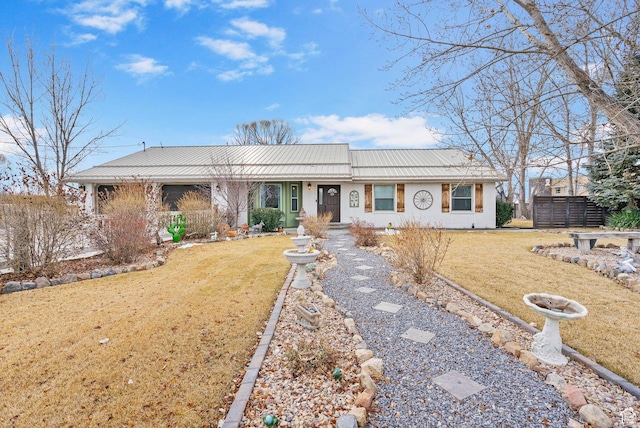 ranch-style house with brick siding, an outdoor structure, a front yard, and fence