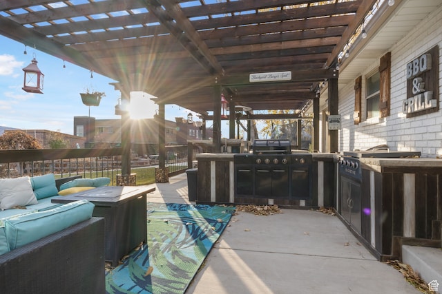 view of patio / terrace with outdoor lounge area, a pergola, and an outdoor kitchen