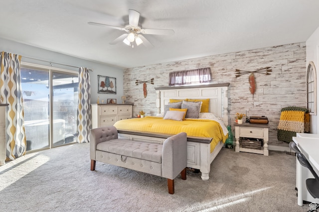 carpeted bedroom featuring access to exterior and ceiling fan