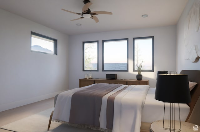 carpeted bedroom with ceiling fan and multiple windows